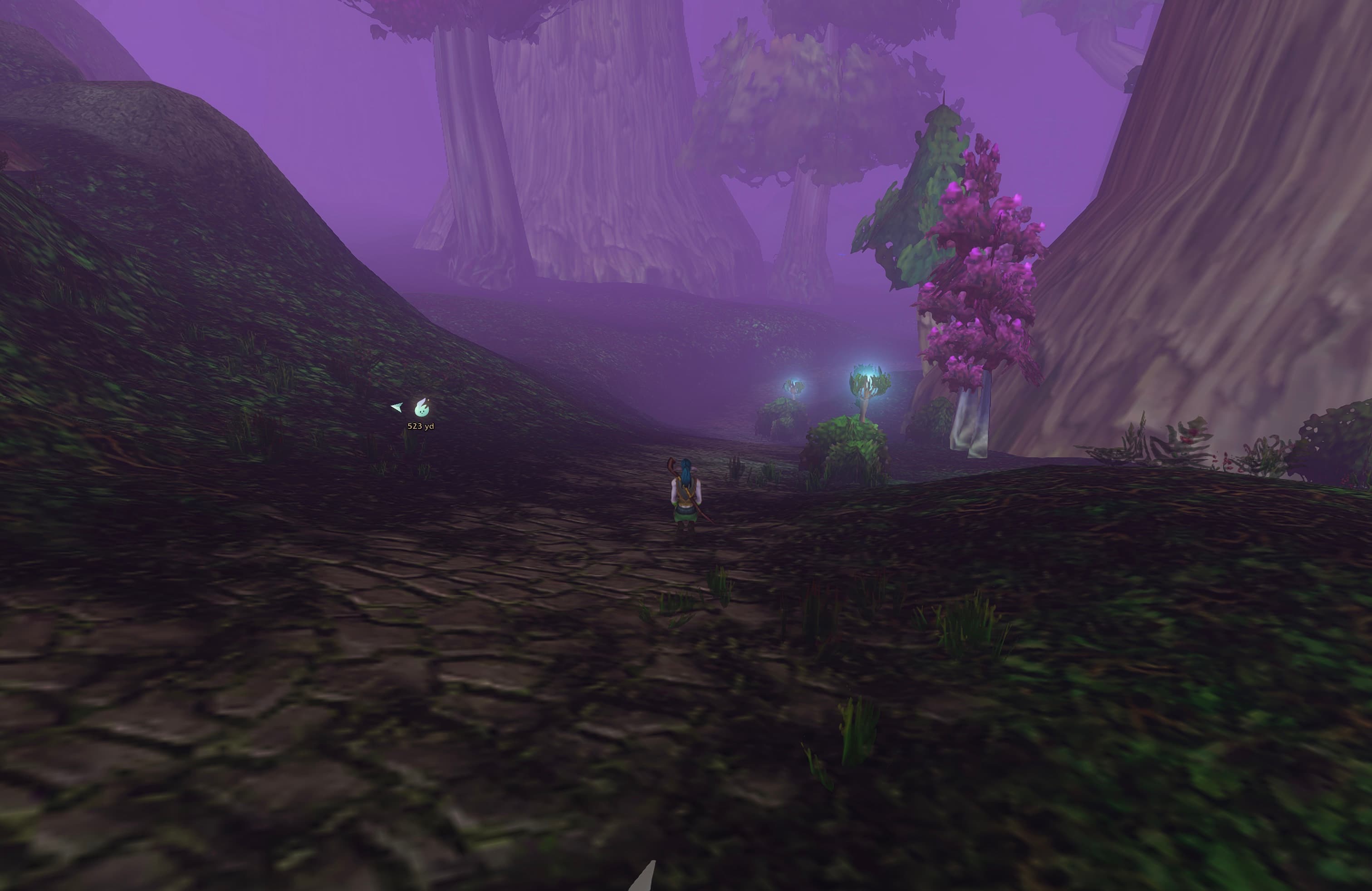 A small arrow beside the Wisp crest points left towards the off-screen destination, while the marker stays on its inset circular boundary.