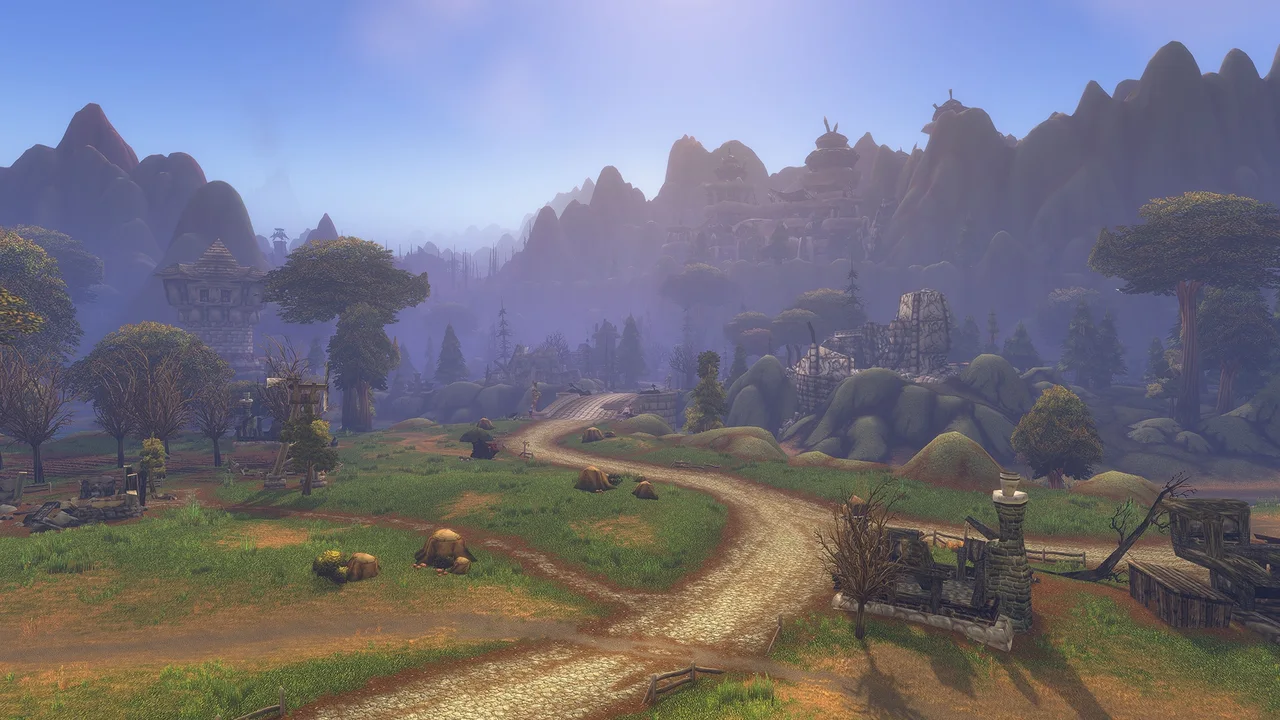 Sunlit winding road across grassy country toward mountain ridges — official forever preview screenshot